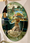 An Italian 1960s Crystal Arte oval mirror with pastel mint green mirrored frame