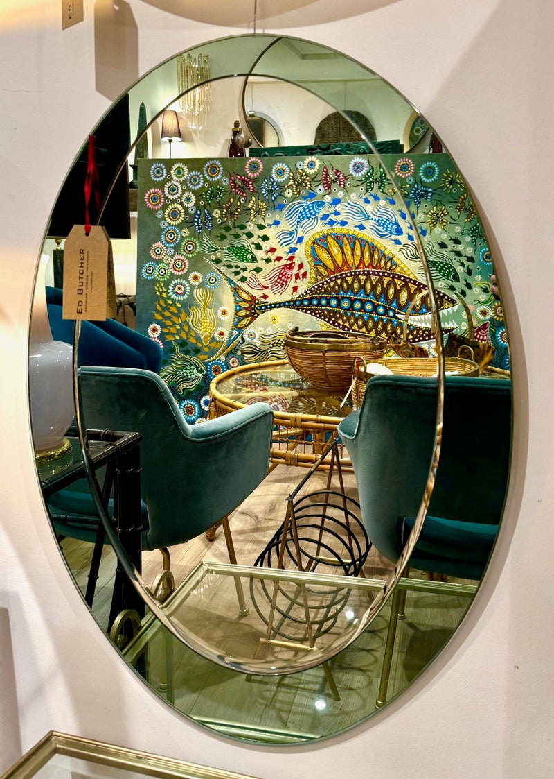 An Italian 1960s Crystal Arte oval mirror with pastel mint green mirrored frame