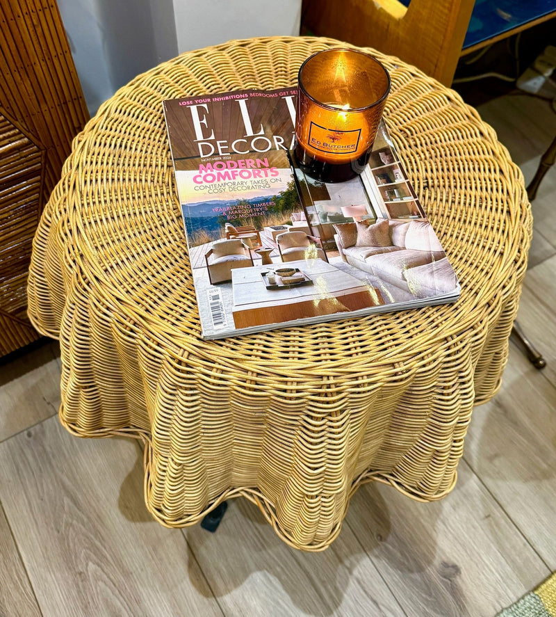 An Italian 1970s woven rattan "draped" side table with cost iron legs