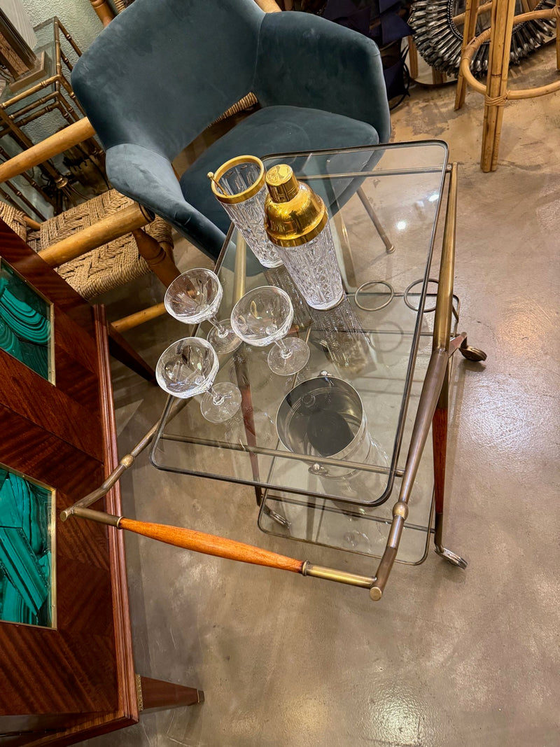 An Italian 1950s brass and lacquered wood bar trolley by Cesare Lacca