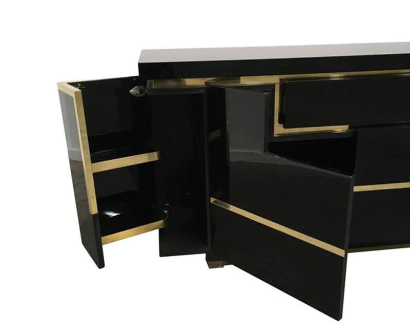 A 1970s vintage black piano lacquer sideboard by Jean Claude Mahey for Roche Bobois with brass detail