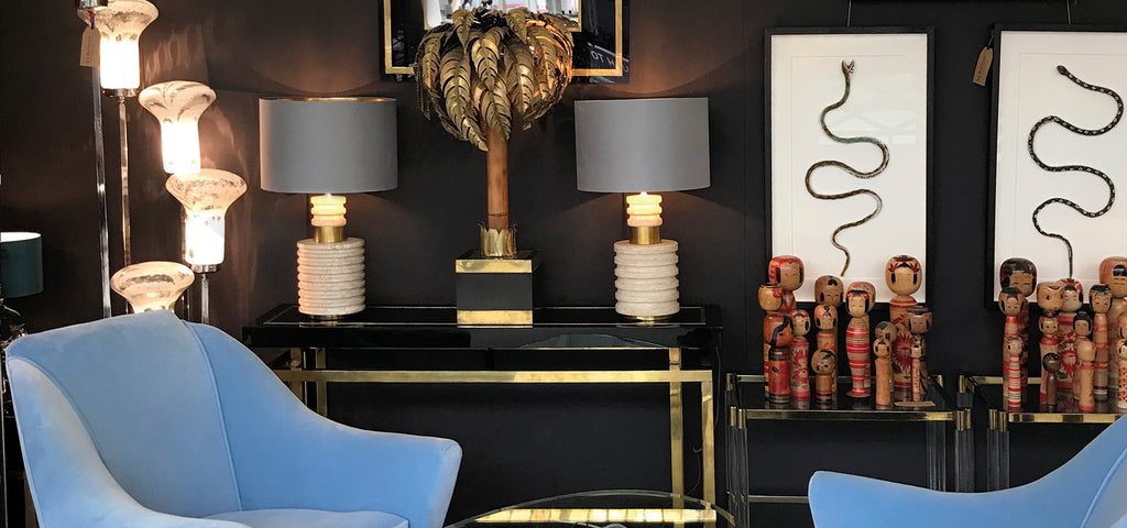 Ed Butcher's Antique Shop London featuring mid century chairs, mid century furniture, Mid century lighting, a mid century console table and a mid century palm tree light. 