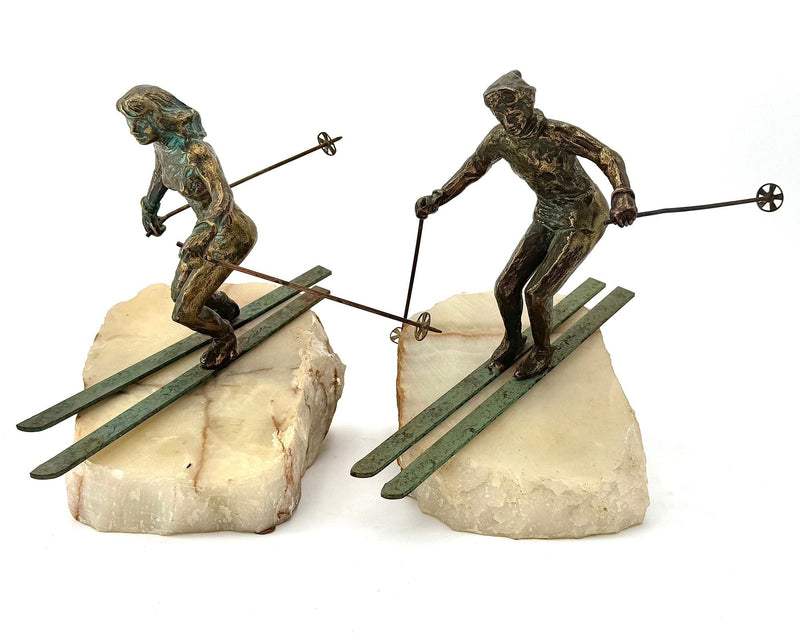 large pair of 1960s bronze cast male & female skiers by Curtis Jere mounted on onyx angled slabs - 1960s
