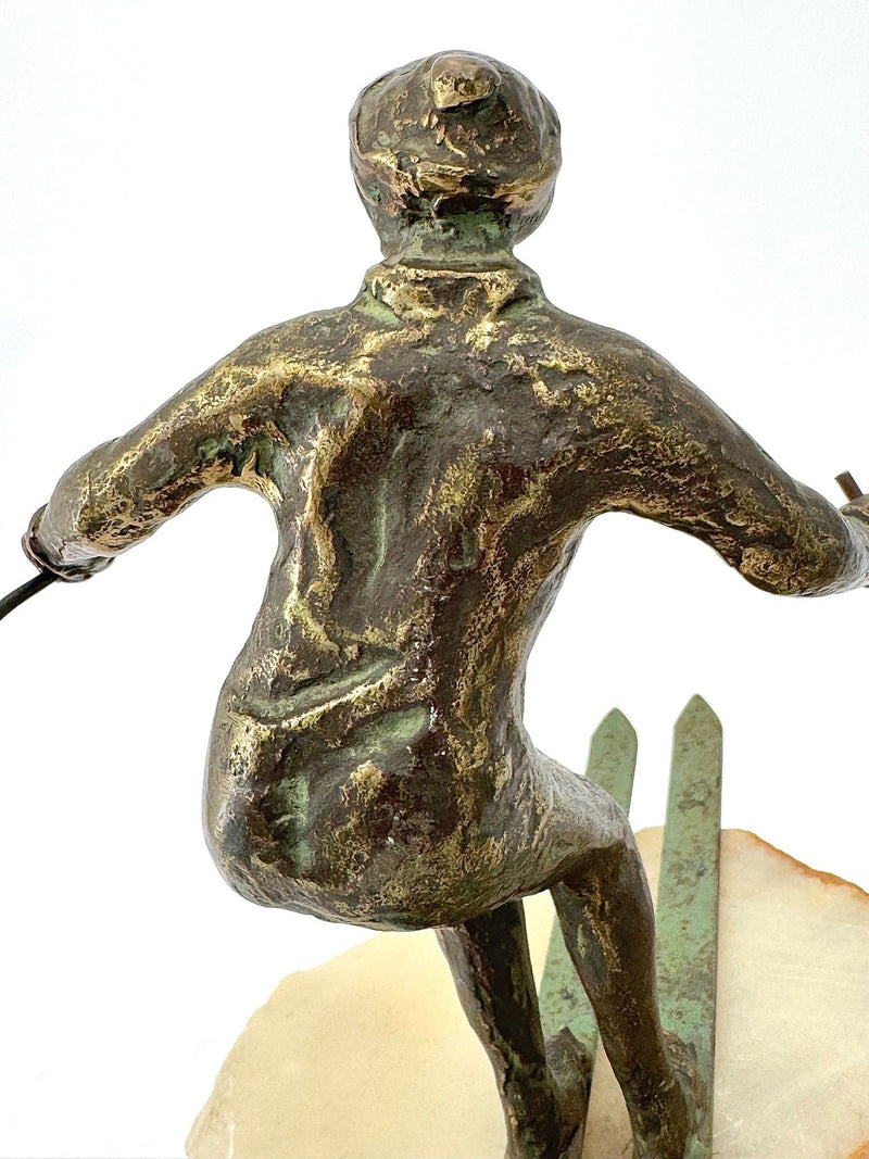 large pair of 1960s bronze cast male & female skiers by Curtis Jere mounted on onyx angled slabs - 1960s