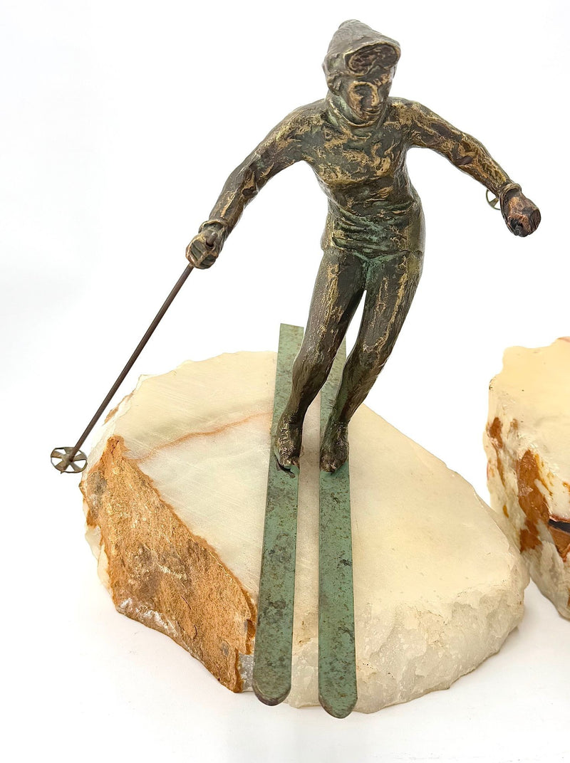 large pair of 1960s bronze cast male & female skiers by Curtis Jere mounted on onyx angled slabs - 1960s