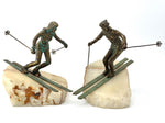 large pair of 1960s bronze cast male & female skiers by Curtis Jere mounted on onyx angled slabs - 1960s