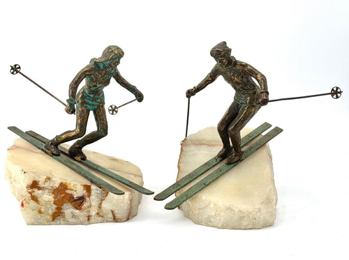 large pair of 1960s bronze cast male & female skiers by Curtis Jere mounted on onyx angled slabs - 1960s