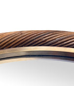 A large oval Italian 1970s twisted rattan and brass mirror in the style of Gabriella Crespi