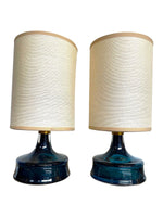 A pair of Swedish Orrefors blue glass lamps by Carl Fagerlund with brass collar