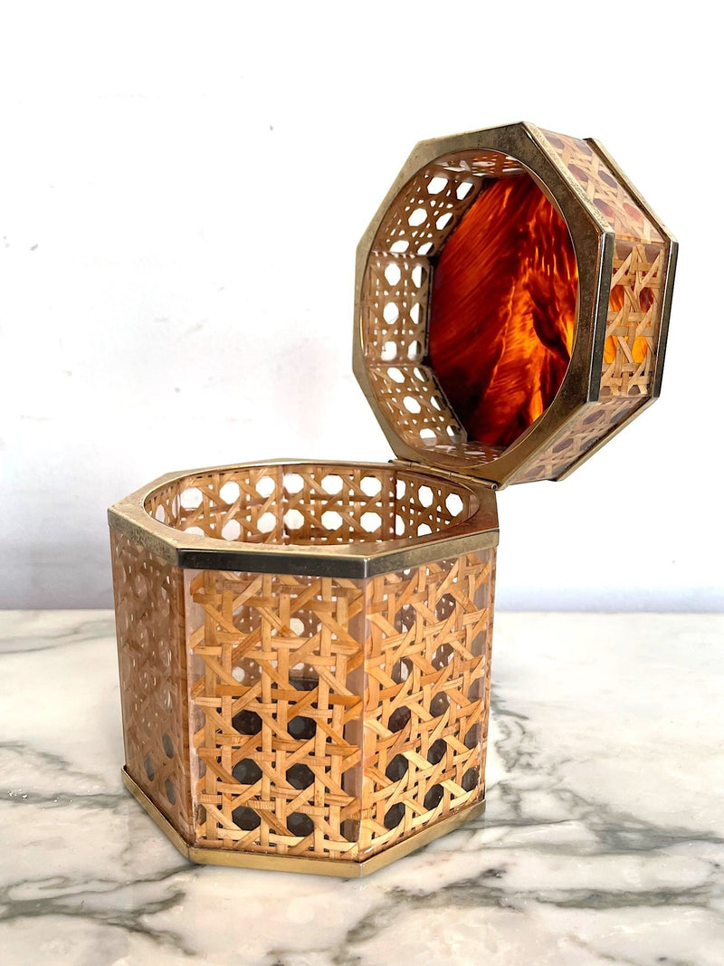 An octagonal rattan jewellery box with brass trim and faux tortoiseshell top in the style of Gabriella Crespi for Dior Home