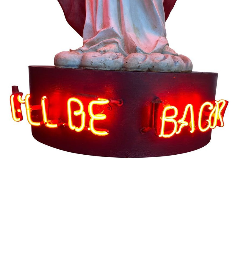 A fantastic original Chris Bracey neon art sculpture of Jesus with neon guns, halo and title on the base “I'll Be Back"