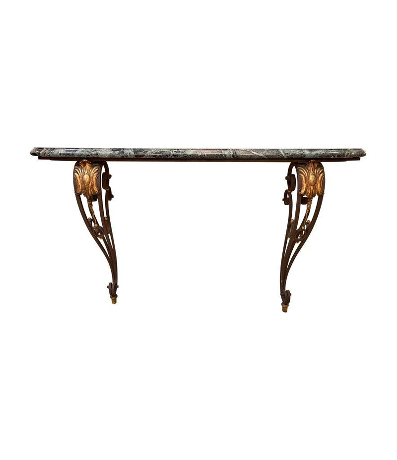 An Art Deco wrought iron gilded console table with green marble top in the style of Gilbert Poillerat