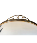 1950S ITALIAN CIRCULAR MIRROR WITH BEVELLED GLASS, BRASS FRAME AND TOP DETAIL