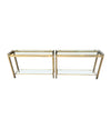 1970S GUY LEFEVRE STYLE GILT METAL CONSOLES WITH TWO GLASS SHELVES