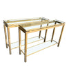1970S GUY LEFEVRE STYLE GILT METAL CONSOLES WITH TWO GLASS SHELVES