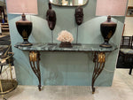 An Art Deco wrought iron gilded console table with green marble top in the style of Gilbert Poillerat