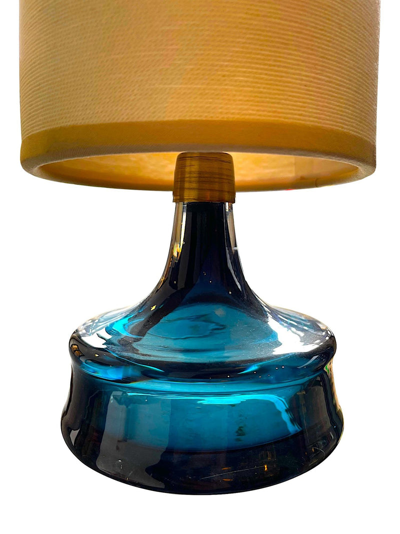 A pair of Swedish Orrefors blue glass lamps by Carl Fagerlund with brass collar