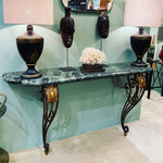 An Art Deco wrought iron gilded console table with green marble top in the style of Gilbert Poillerat