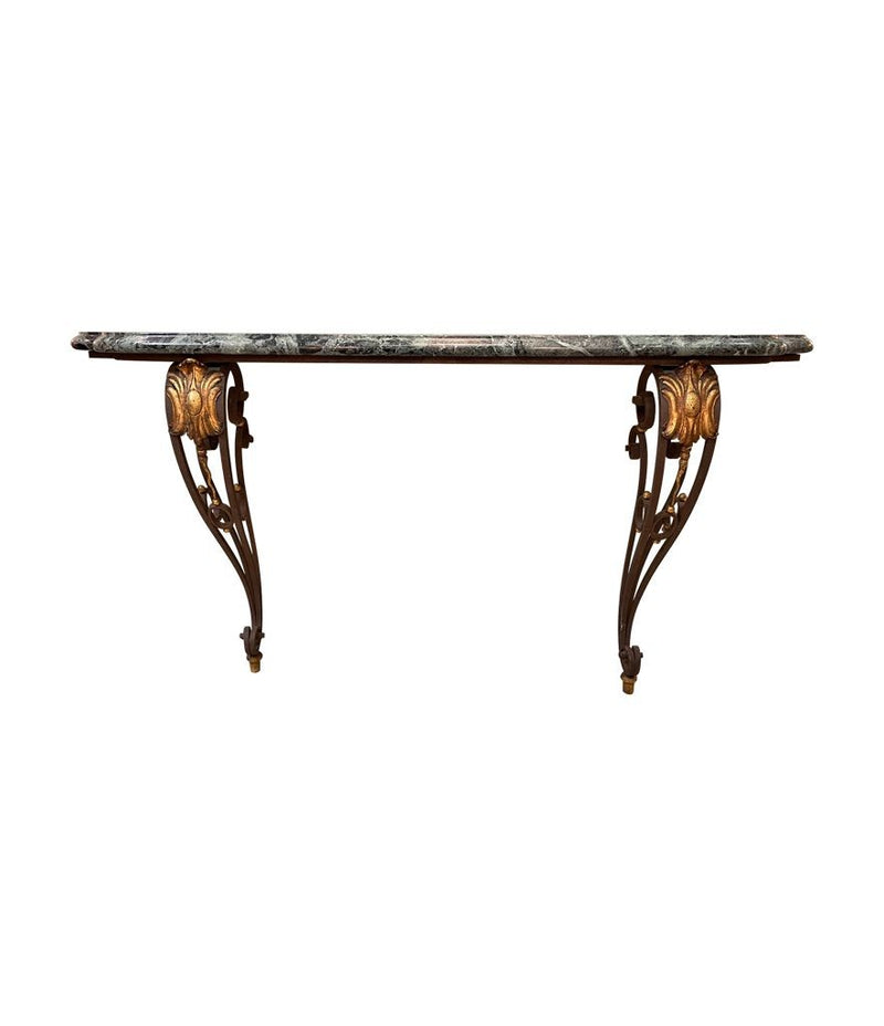 An Art Deco wrought iron gilded console table with green marble top in the style of Gilbert Poillerat