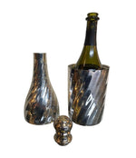 A LARGE 1950S SILVER PLATED CHAMPAGNE BOTTLE COOLER IN THE SHAPE OF A CHAMPAGNE BOTTLE