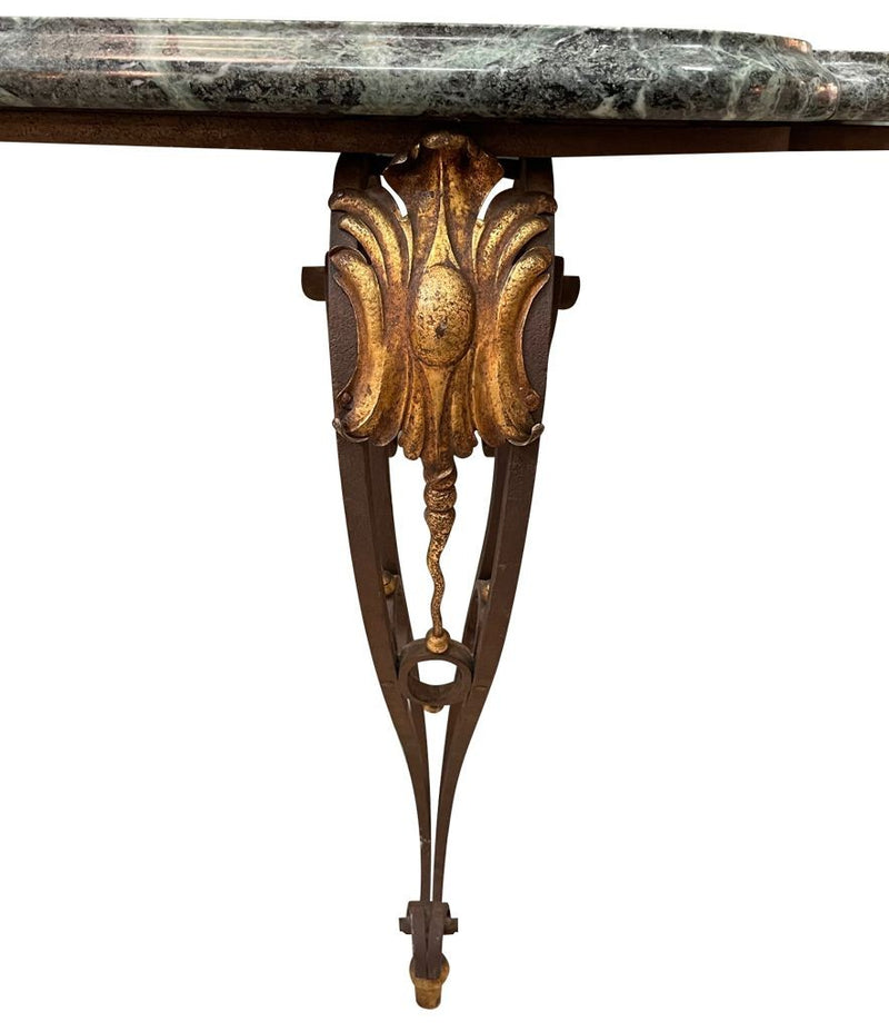 An Art Deco wrought iron gilded console table with green marble top in the style of Gilbert Poillerat