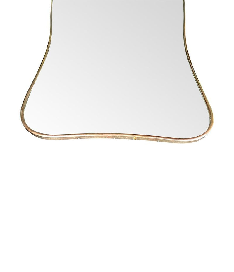 A large original 1950s Italian curved brass framed mirror with original plate