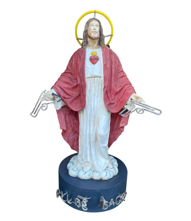A fantastic original Chris Bracey neon art sculpture of Jesus with neon guns, halo and title on the base “I'll Be Back"