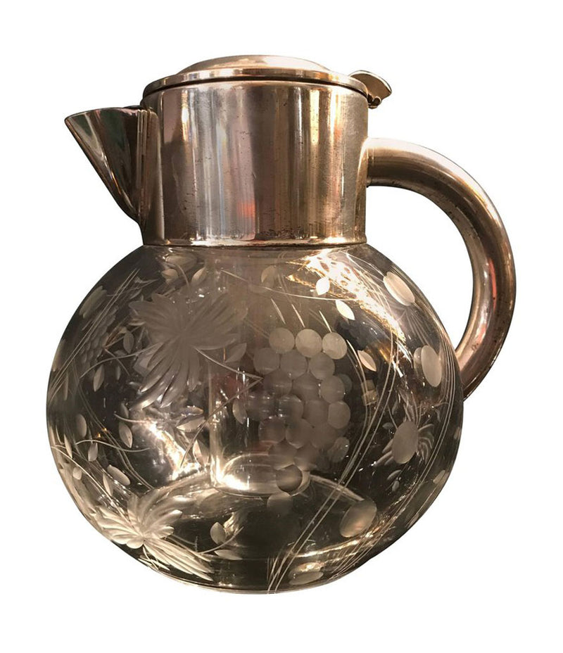 A BEAUTIFUL CUT GLASS COCKTAIL JUG WITH SILVER PLATE