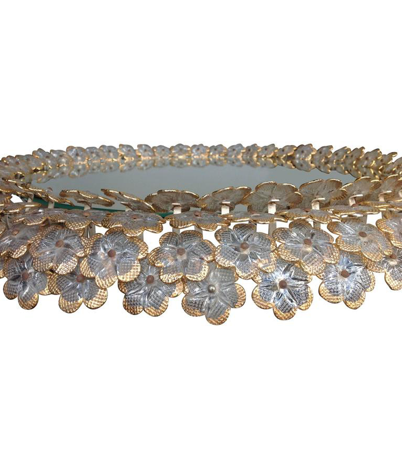 A BEAUTIFUL EMIL STEJNAR BACK LIT MIRROR WITH GLASS FLOWERS SURROUND
