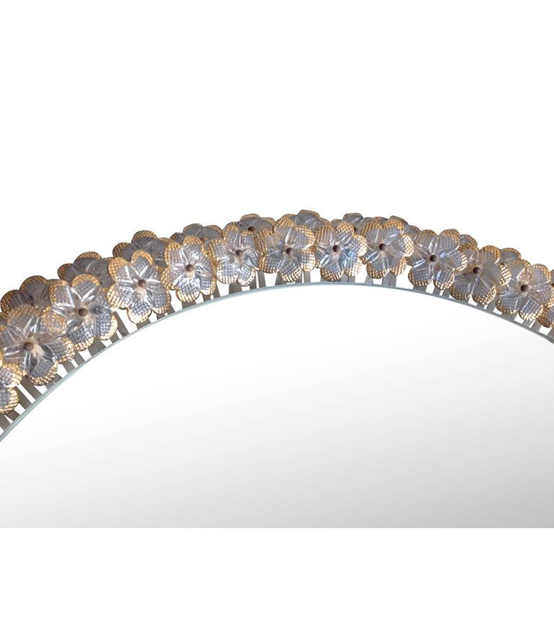 A BEAUTIFUL EMIL STEJNAR BACK LIT MIRROR WITH GLASS FLOWERS SURROUND