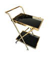 A BRASS BAR TROLLEY WITH BLACK GLASS SHELVES