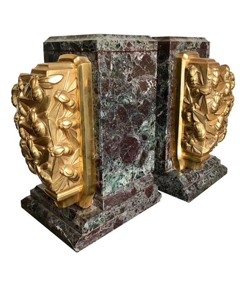 A PAIR OF ART DECO BOOKENDS OF AMAZONITE MARBLE AND CAST GILT METAL BEES