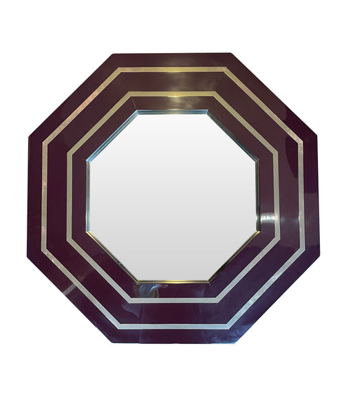 A 1970s octagonal mirror by Jean Claude Mahey with brass inlay frame
