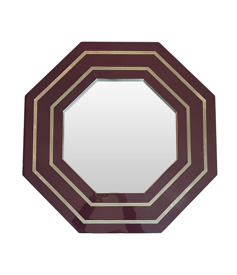 A 1970s octagonal mirror by Jean Claude Mahey with brass inlay frame