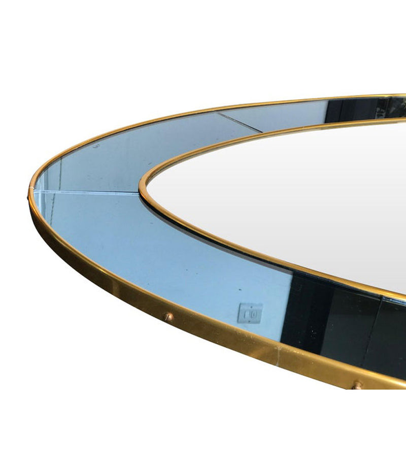 LARGE OVAL MIRROR IN THE MANNER OF CRISTAL ARTE WITH BLUE MIRROR SURROUND