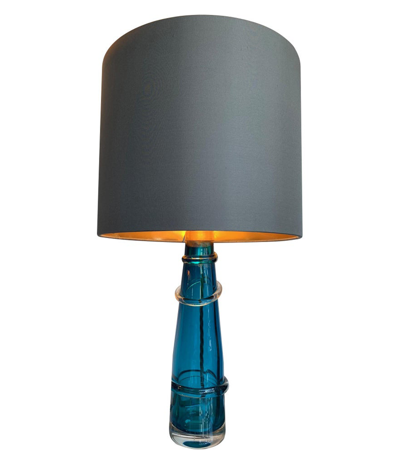 PAIR OF ORREFORS TURQUOISE GLASS LAMPS WITH BRASS FITTINGS AND BESPOKE SHADES