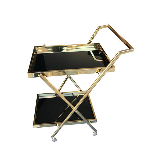 A BRASS BAR TROLLEY WITH BLACK GLASS SHELVES