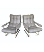 UNUSUAL PAIR OF ITALIAN 1970S CANTILEVERED ARMCHAIRS WITH BRUSHED METAL LEGS